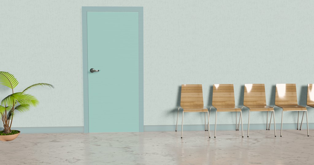 Waiting room of a dental office with chairs, door and plant