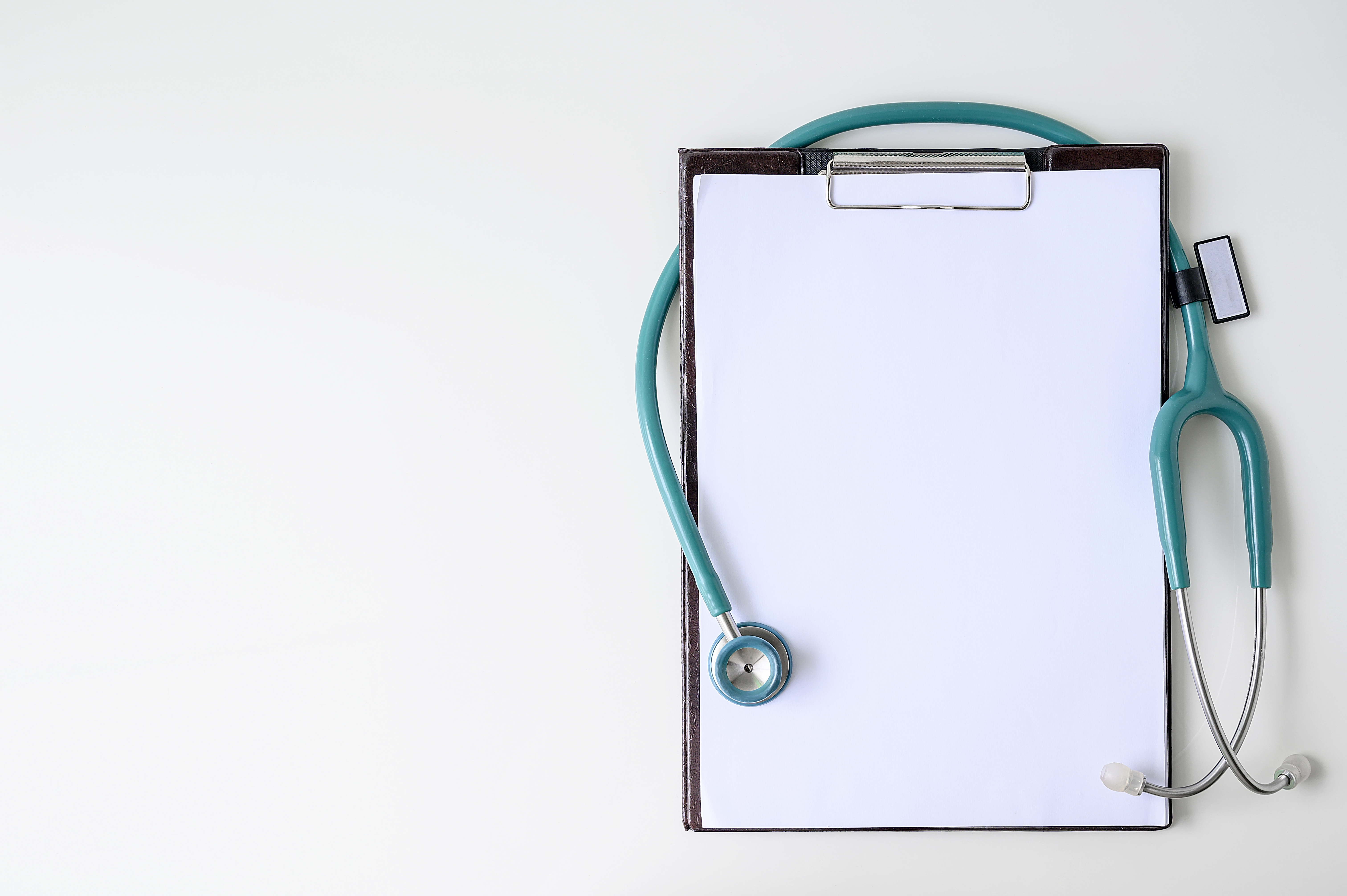 Clipboard with turquoise stethoscope