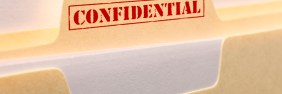Manilla folder with a red Confidential stamp