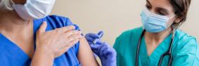nurse giving vaccine | best states for registered nurses