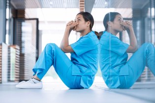 woman sitting thinking about negligence in nursing