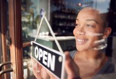 woman hitting her small business goals of opening business