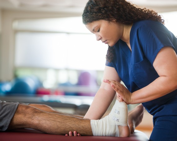 physical therapist working on a client in their practice 