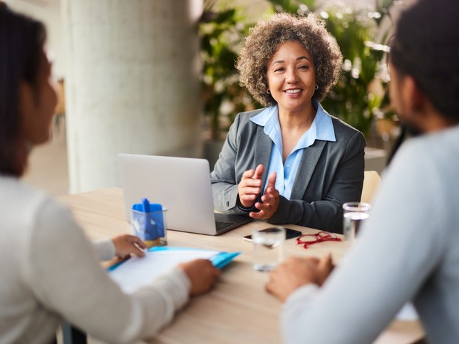 woman on laptop at meeting discussing tax preparer insurance cost