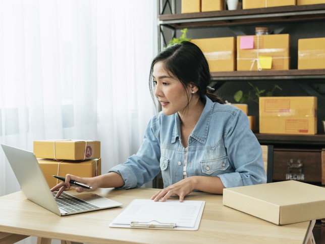 woman typing on laptop researching bop vs. gl